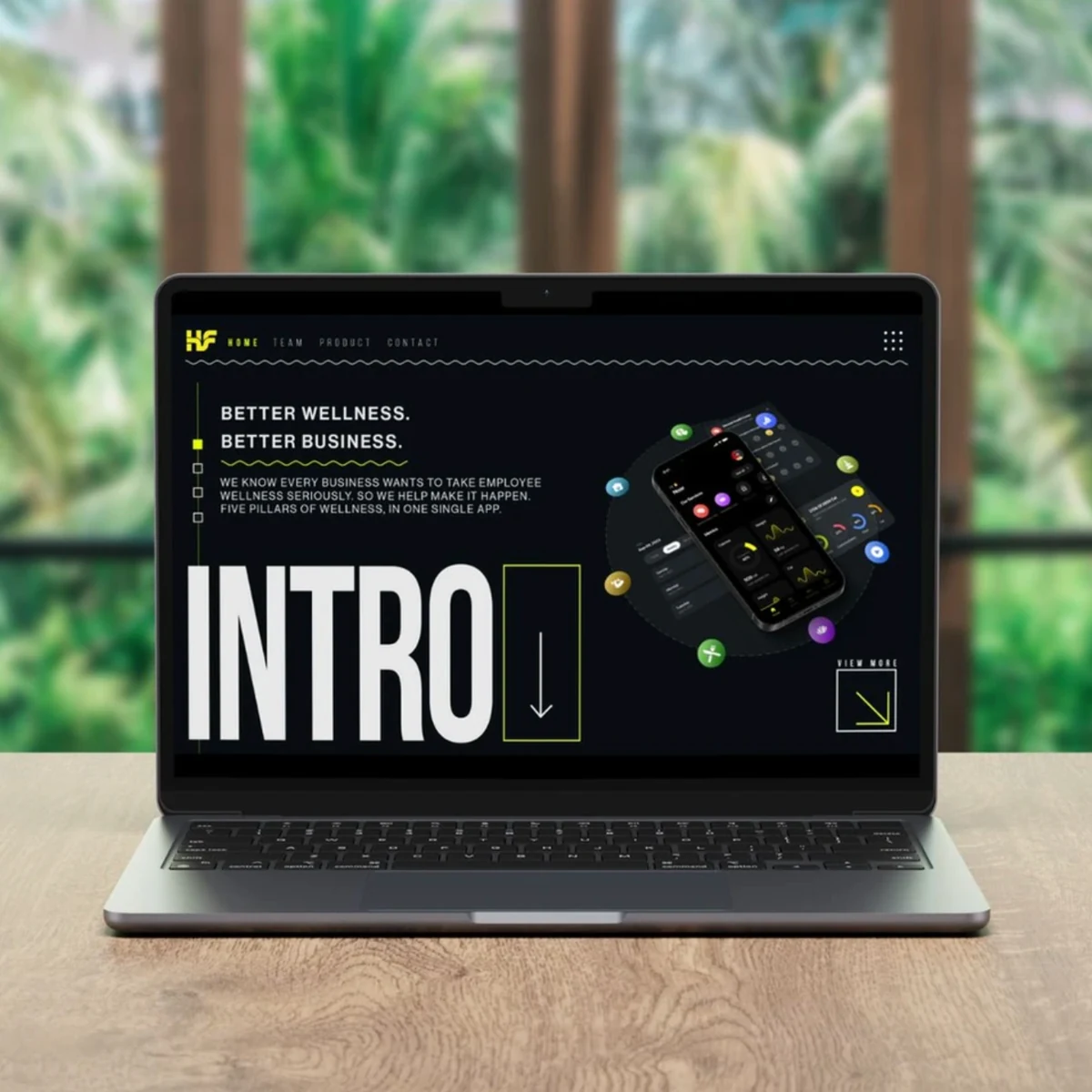 HubFiiiT workplace wellness website displayed on a laptop, using the black and yellow identity