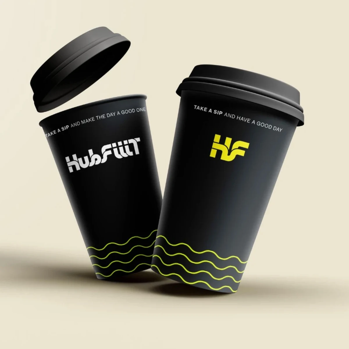 HubFiiiT promotional cups with the original wordmark, monogram and yellow flowing lines